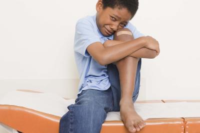 boy crying with leg pain