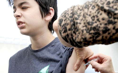 14-yo boy getting a vaccination