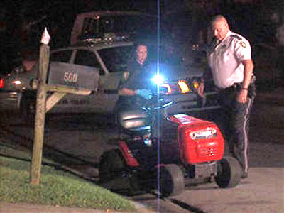 Police investigating a child vs lawn mower injury