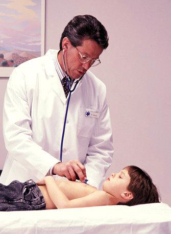 Doctor listening to a child's heart murmur