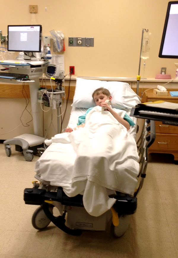 Boy with appendicitis receiving antibiotics in ER
