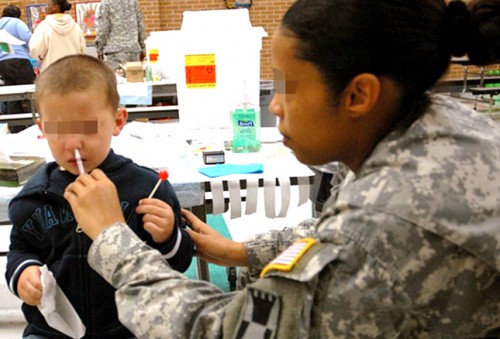 Boy receiving the seasonal influenza vaccine by the nasal route