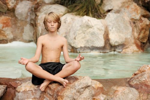 Teen using a yoga pose as meditation