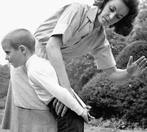 Discipline: Mother spanking a boy