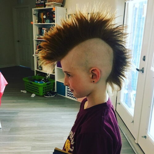 Small boy with red mohawk hair style